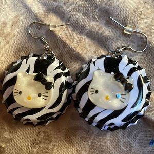 Hello kitty earrings in zebra and beer caps